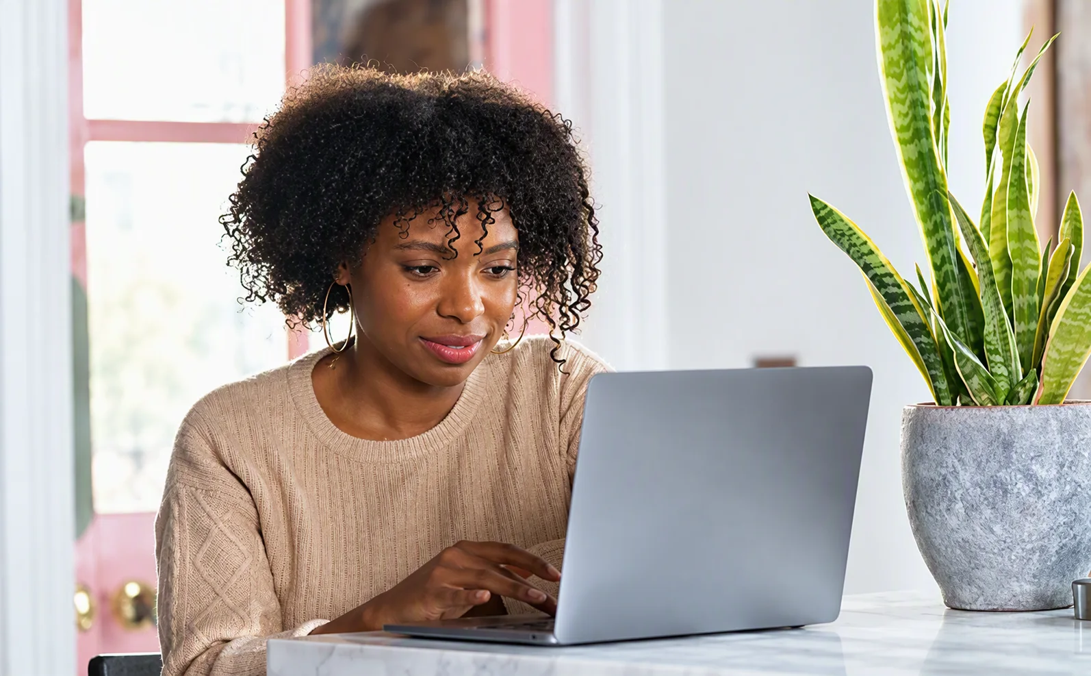Person using a laptop for online payments and digital transactions at home