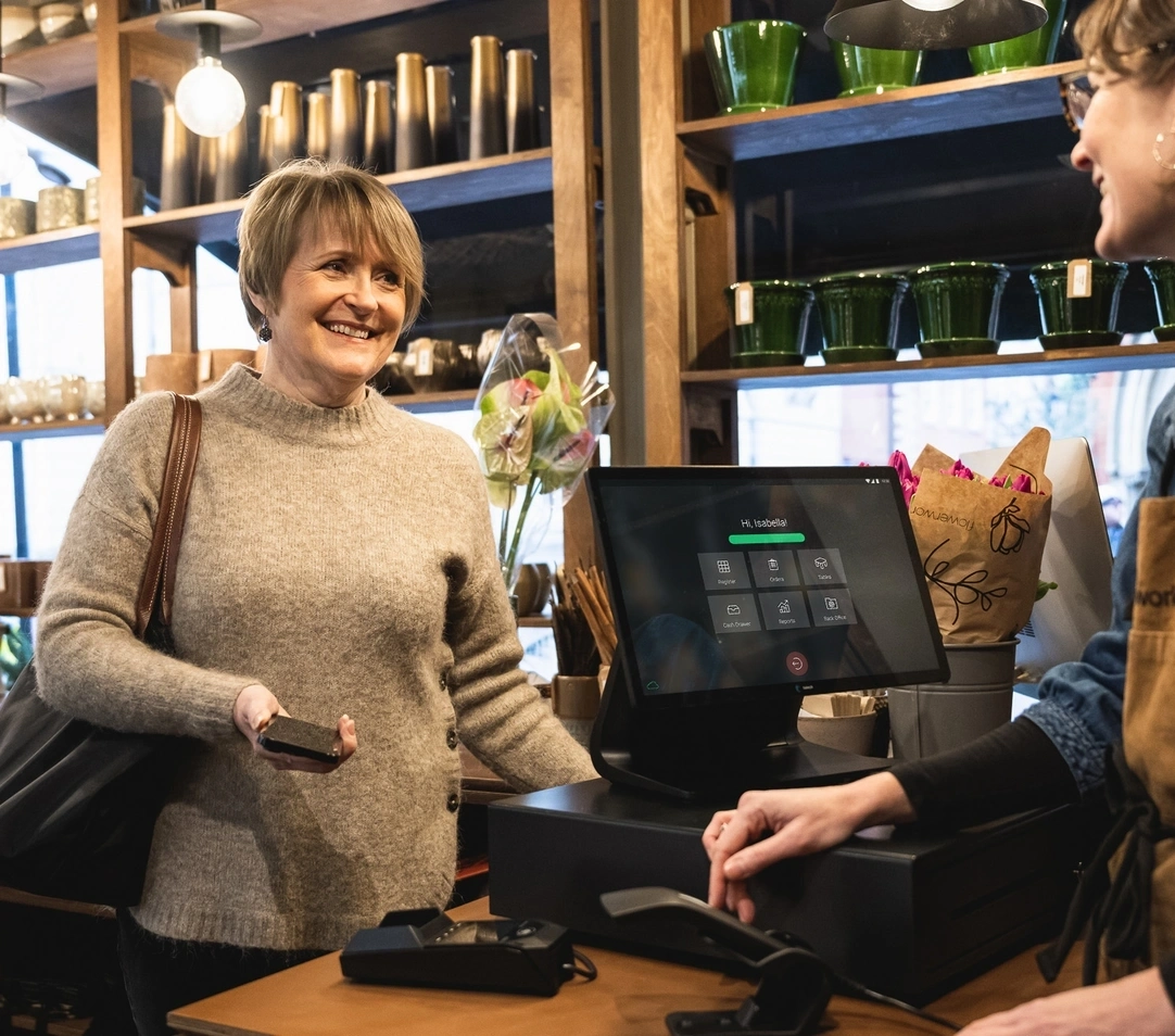 Lady making a payment at cash register