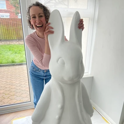 Artist Sharon Armstrong with the Elavon Peter Rabbit sculpture before it was painted