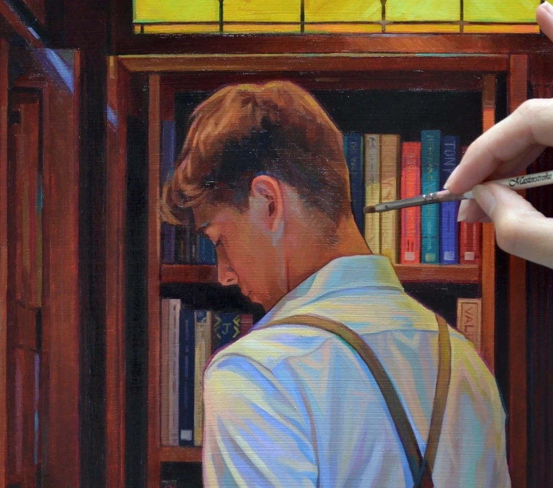 Artist Elysia Gilman paints a detailed scene of a figure standing at a bookcase, holding an open book, as she adds fine brushwork to the artwork